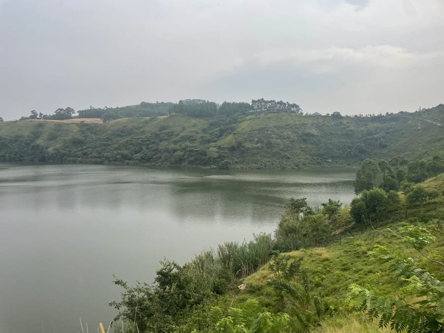 Crater lake ringed by cultivated hillsides, Fort Portal